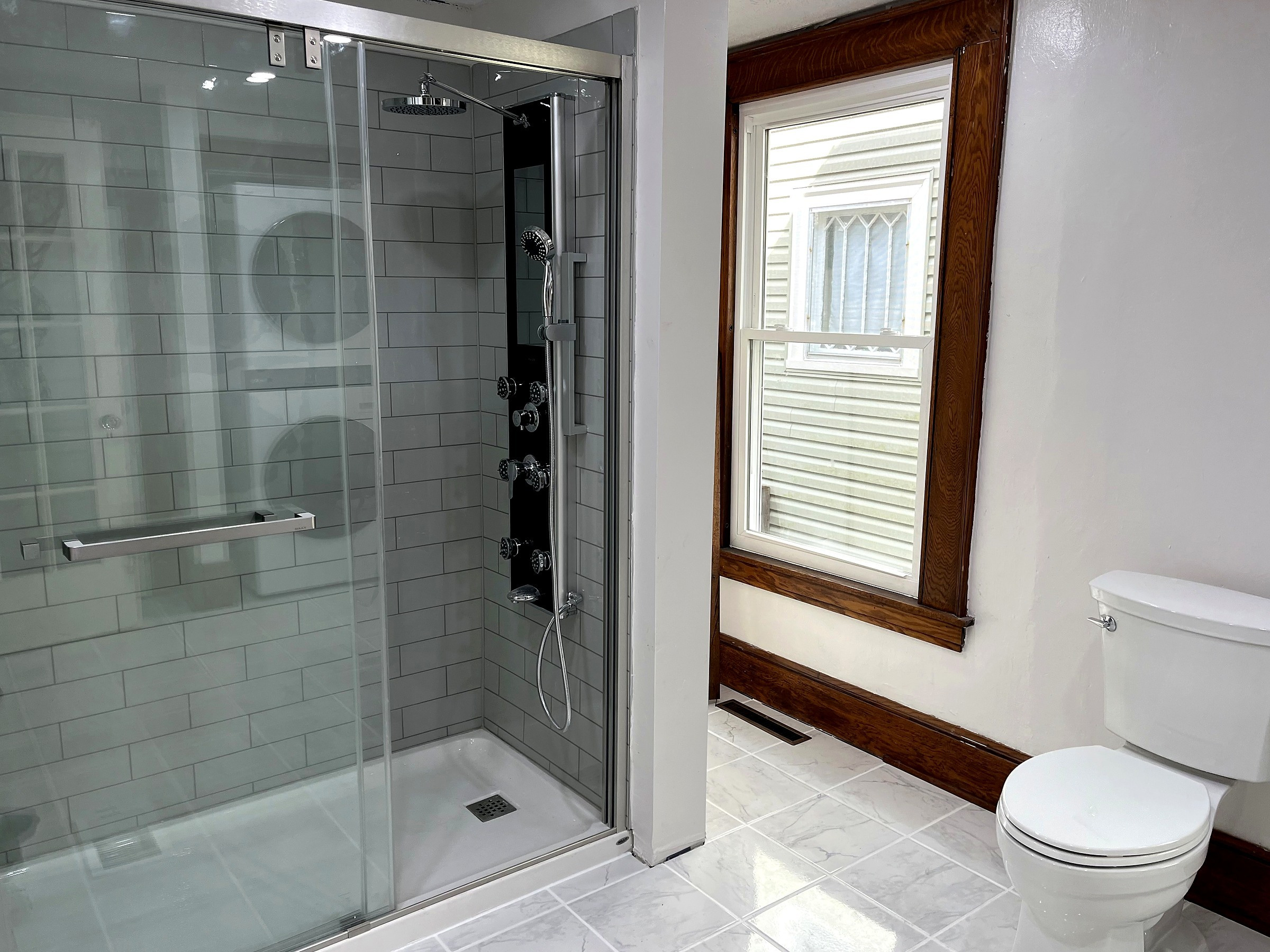 Bright walk-in shower remodel